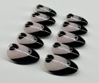 Set of black and white decorative items on a light gray background
