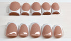 Set of nude base nail polish with white french tips 