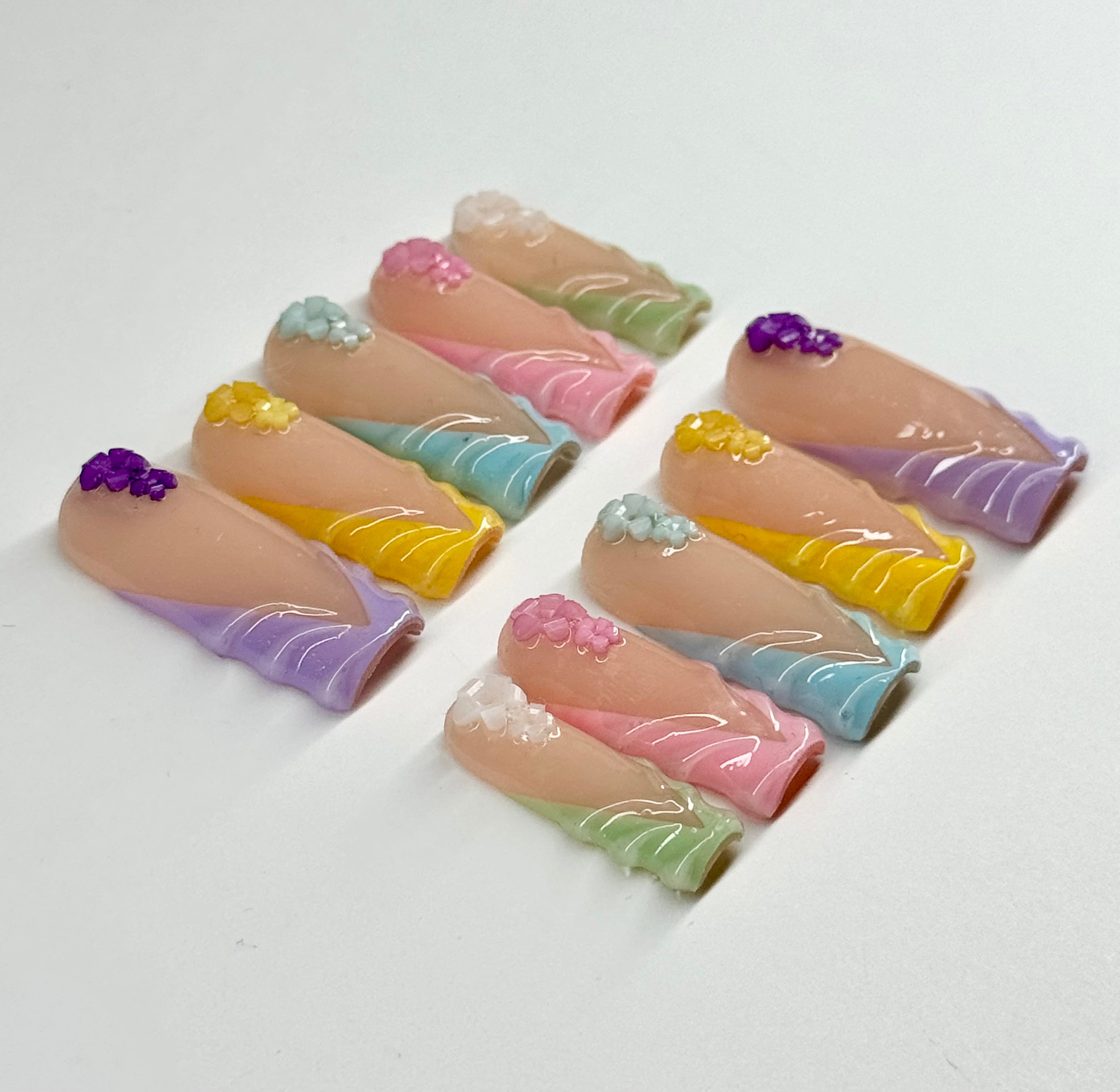 Set of colorful nail art designs on a white background