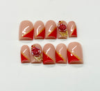 Set of nail art designs with roses and gold accents on a white background