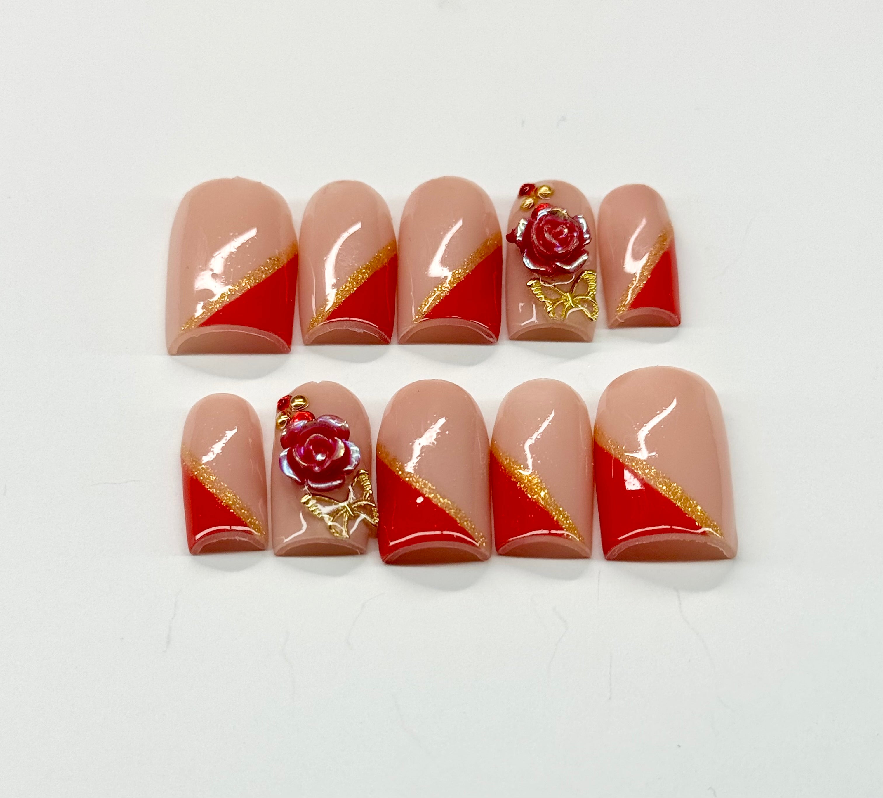 Set of nail art designs with roses and gold accents on a white background