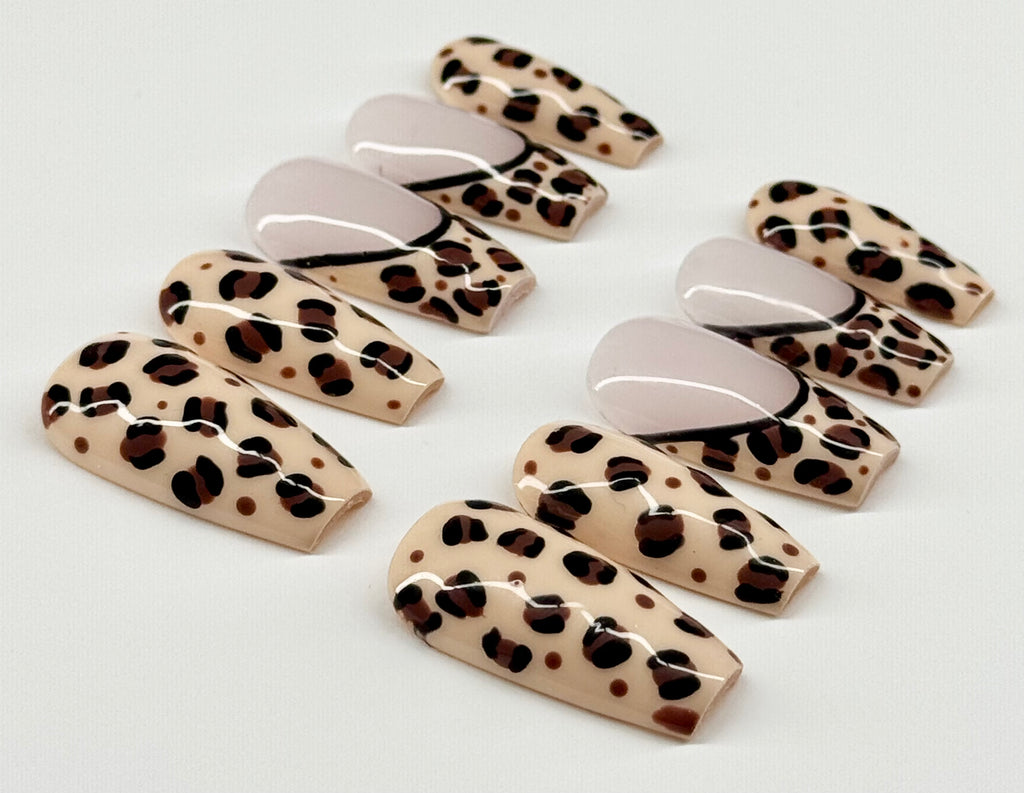 Set of leopard print false nails on a light background
