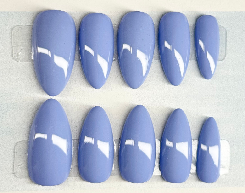 Set of blue nail polish on a white background