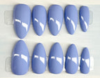 Set of blue nail polish on a white background