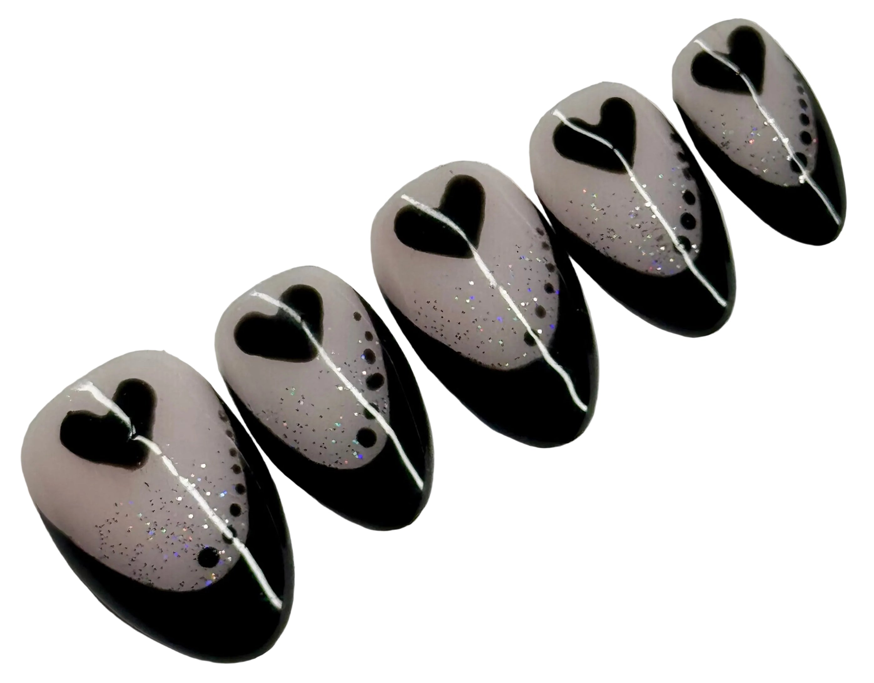 Black, white, and gray decorative items with heart shapes on a light gray background