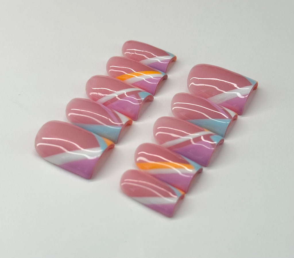 Colorful marbled nail art on a white background