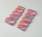 Colorful marbled nail art on a white background