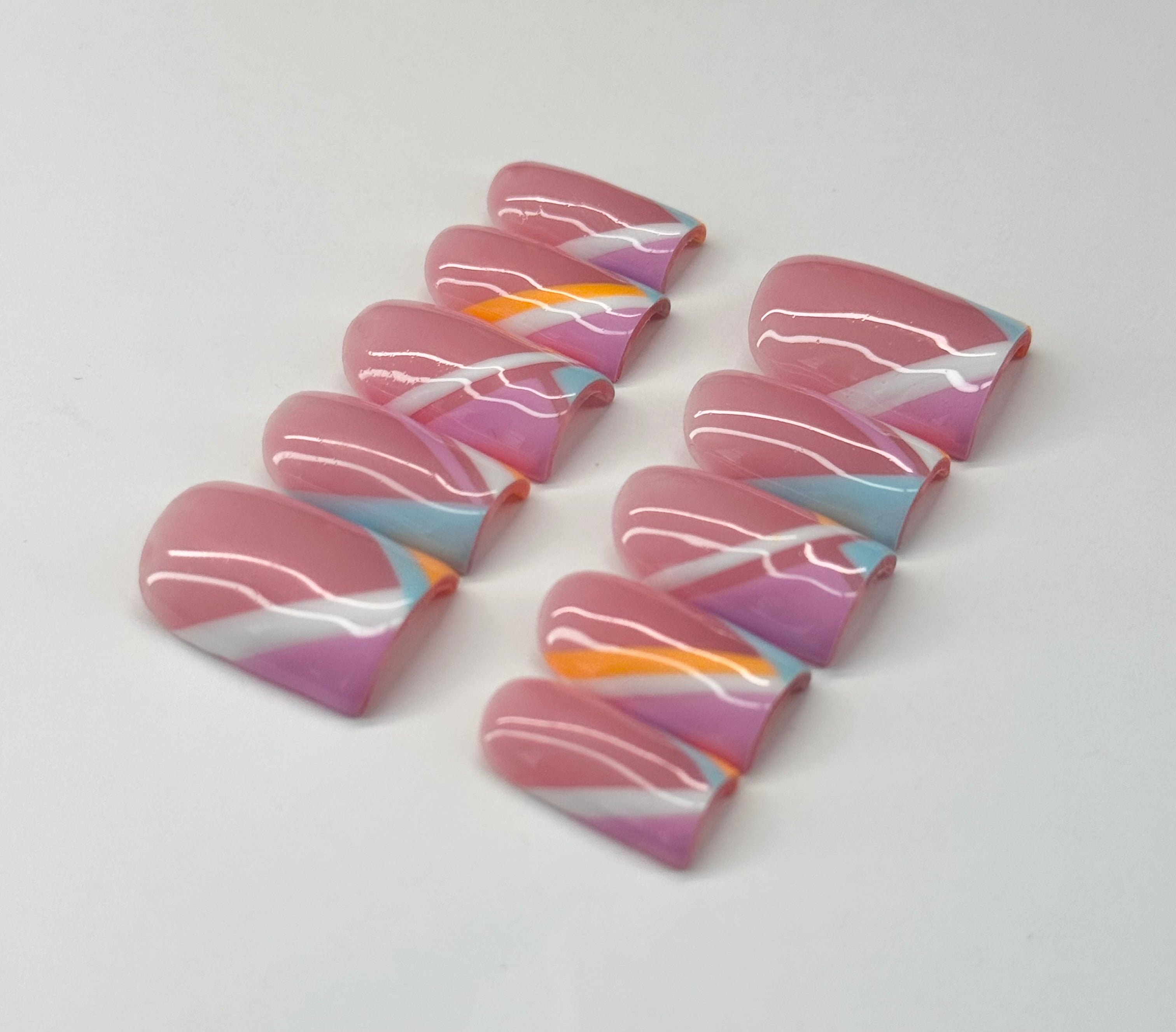 Colorful marbled nail art on a white background