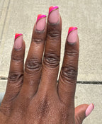 Realistic Hand with pink nail polish on a neutral background