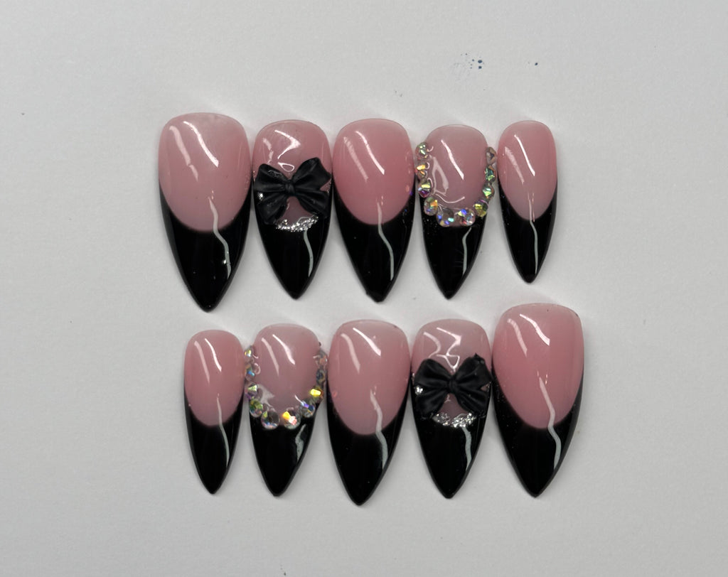 Set of nude pink and black french tip nail designs on a light gray background
