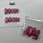 Cat eye nail tips with white stripes on a Nailene branded card.