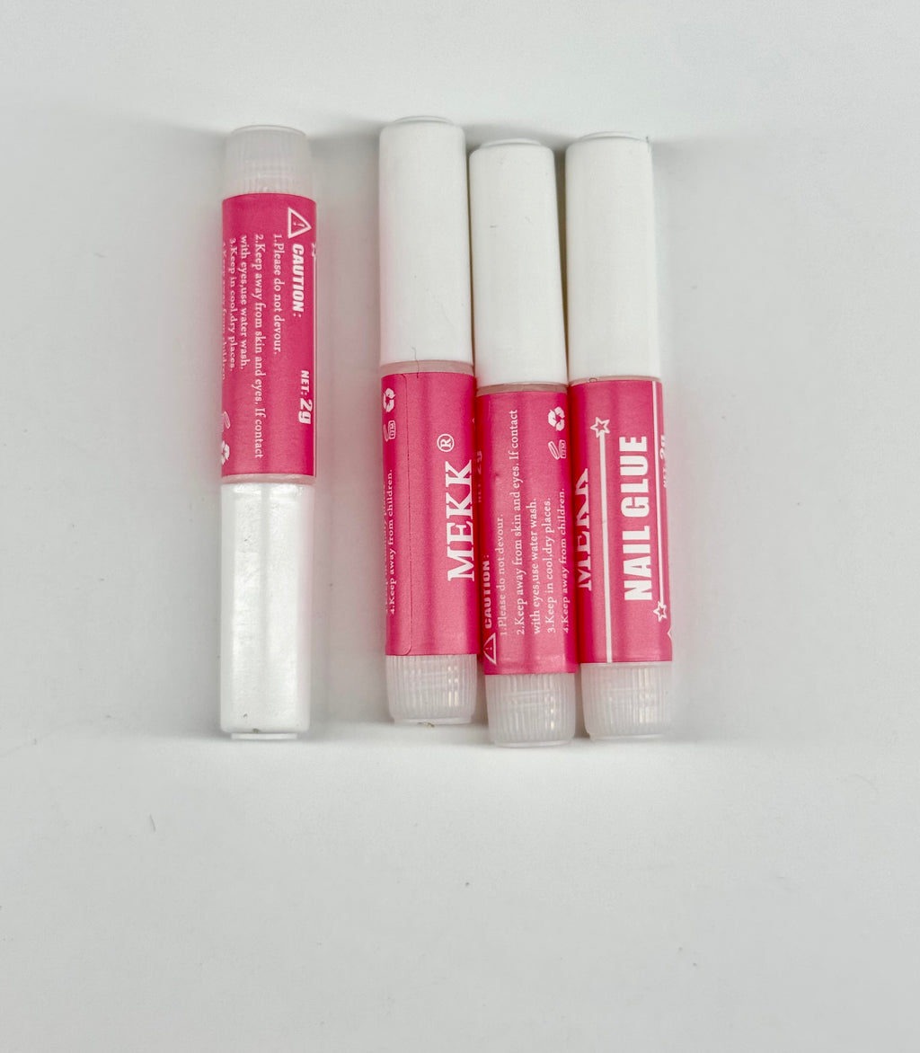 Four tubes of MEKK nail glue on a white background