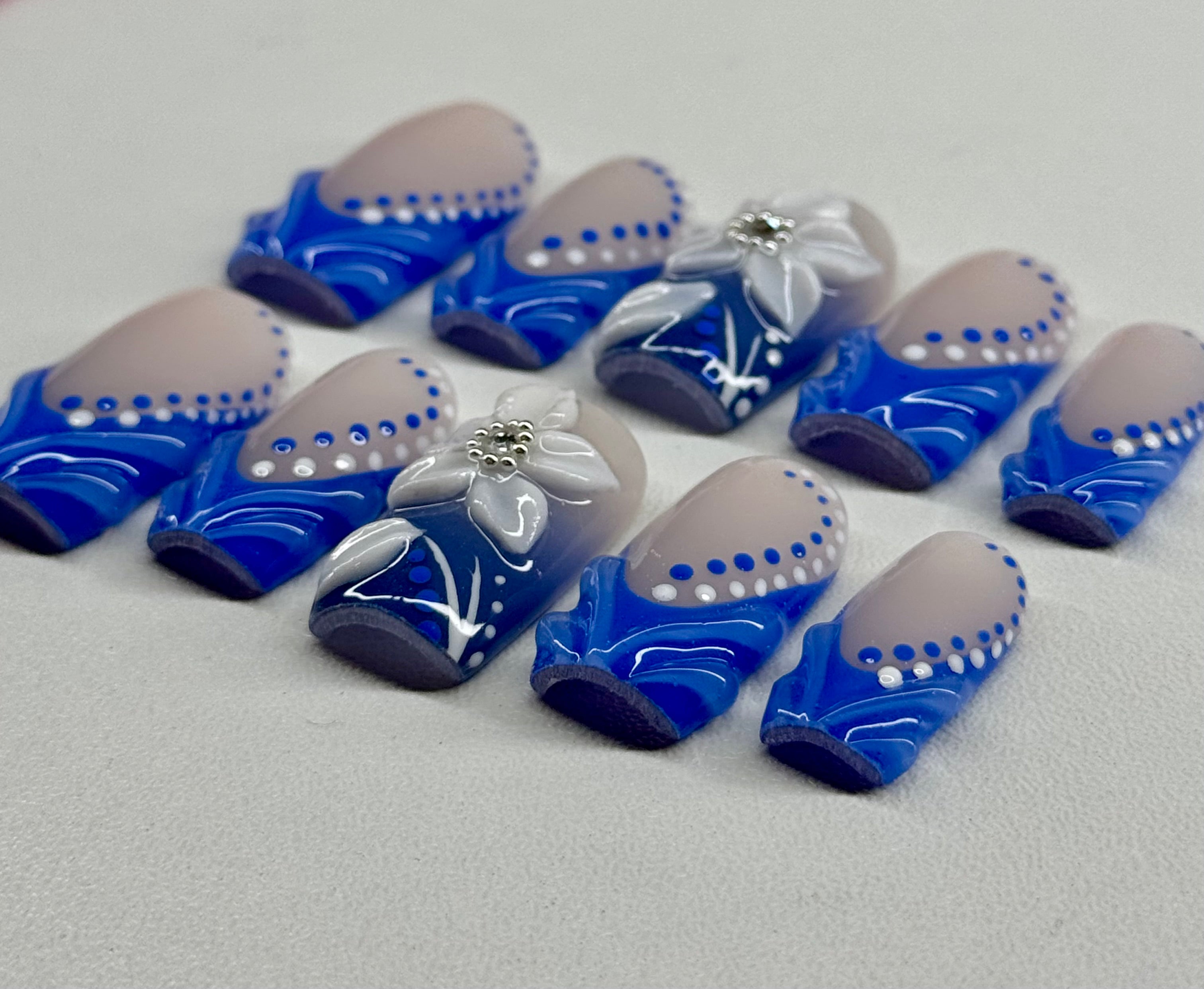 Blue and white decorative items on a gray surface