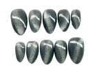 Row of cat eye glittery nail art designs 