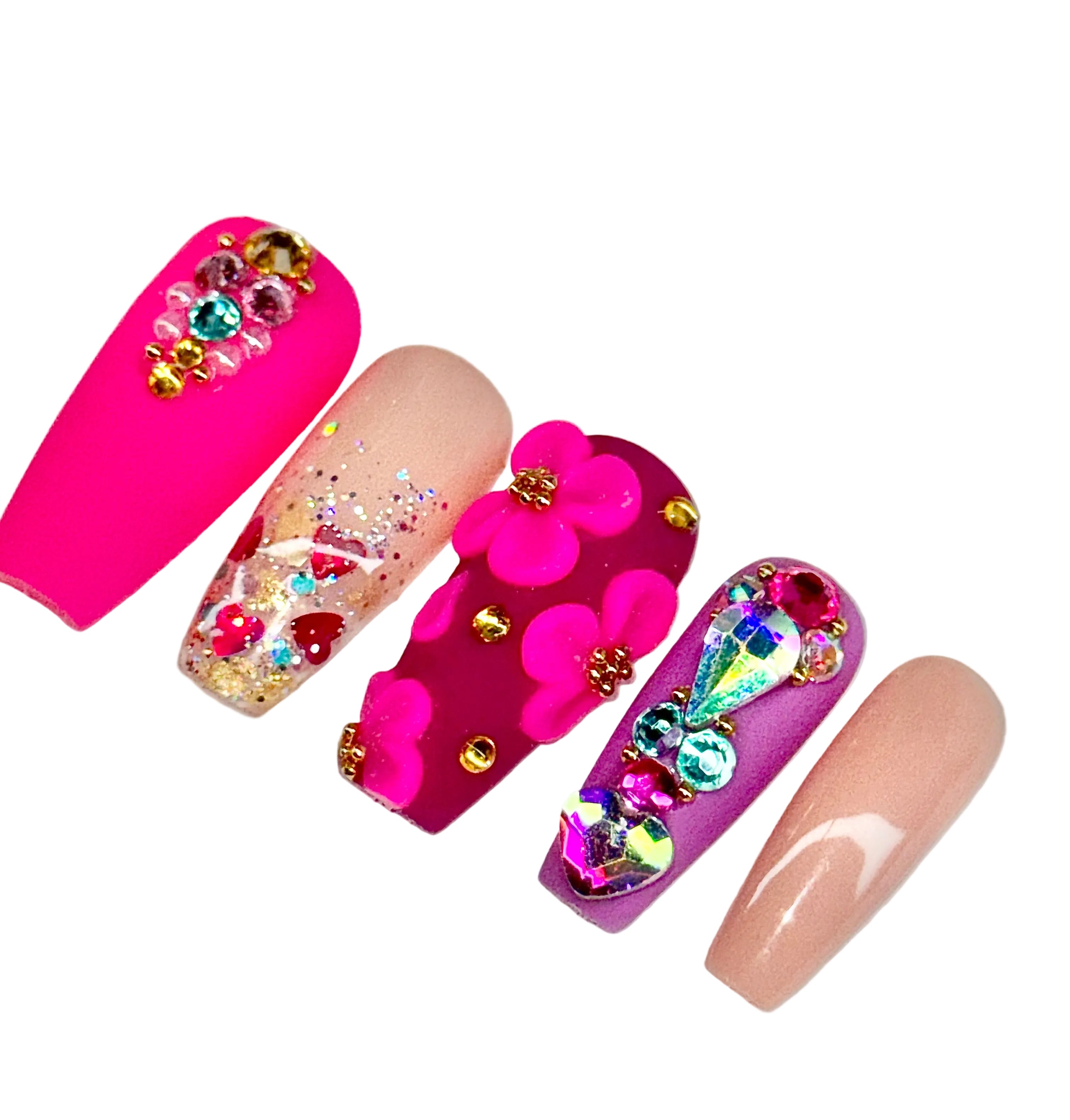 Colorful nail art design with flowers and rhinestones on a white background, featuring the Nailene Nail Studio logo.