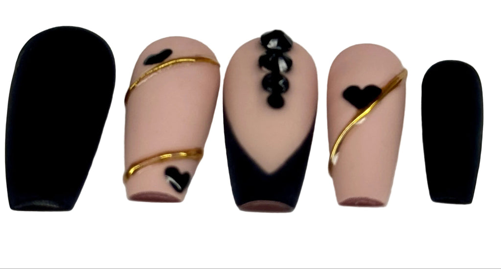 Set of nails with black and gold designs on a white background, featuring the Nailene Nail Studio logo.