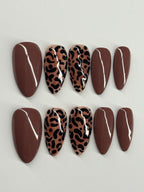 Set of decorative stones with leopard print patterns on a light gray background