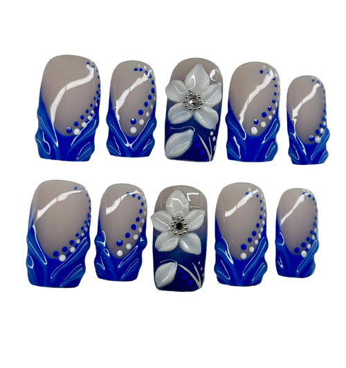 Set of nail art designs with blue, and white colors on a gray background