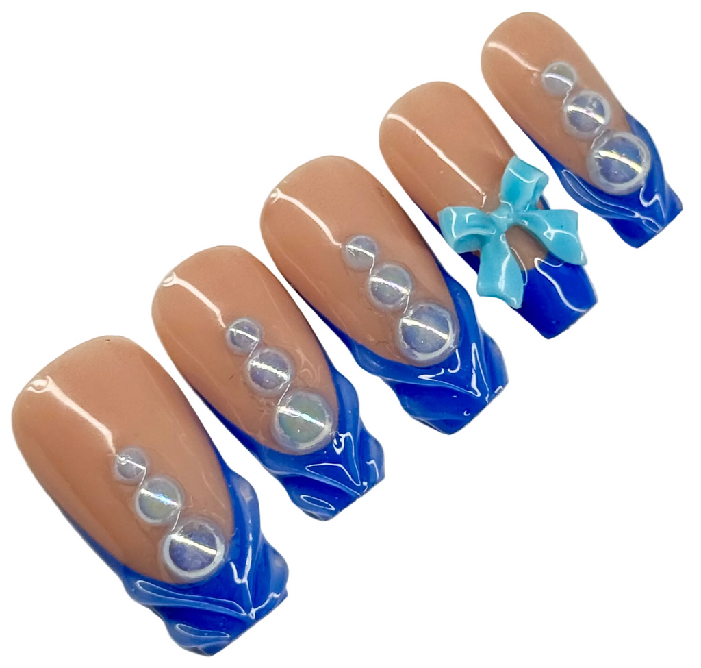 Nail art design with blue and brown colors on a white background