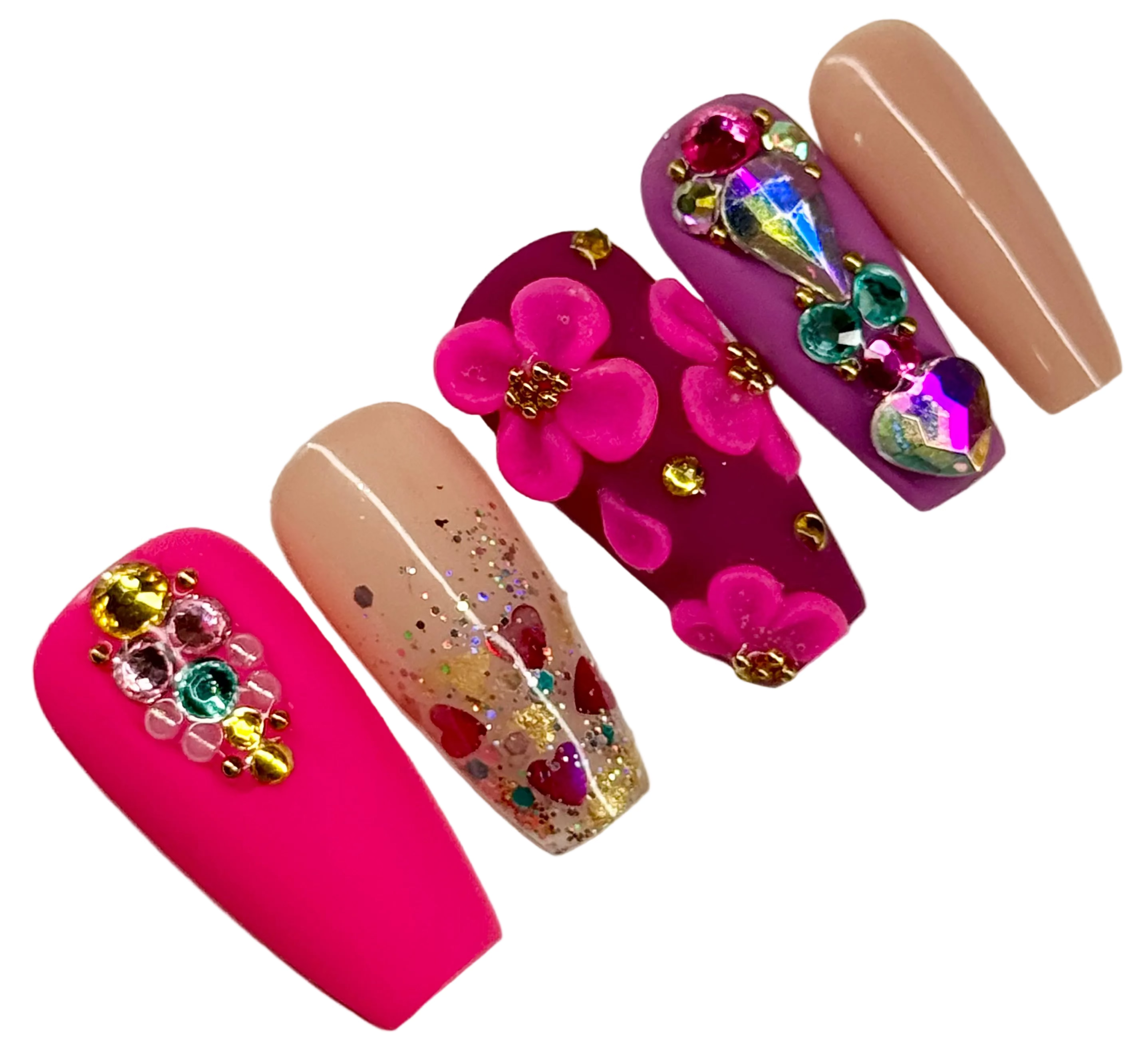 Decorative nail art with flowers and gemstones on a white background