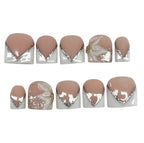 Set of beige and white nail art designs with decorative elements on a white background