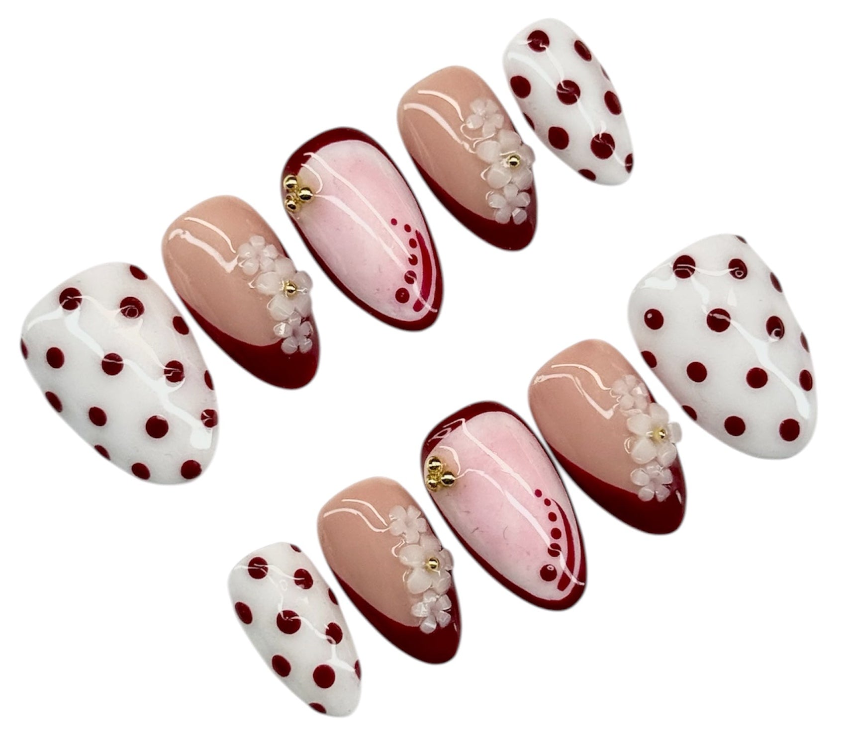 Set of nail art designs with polka dots and floral patterns on a white background