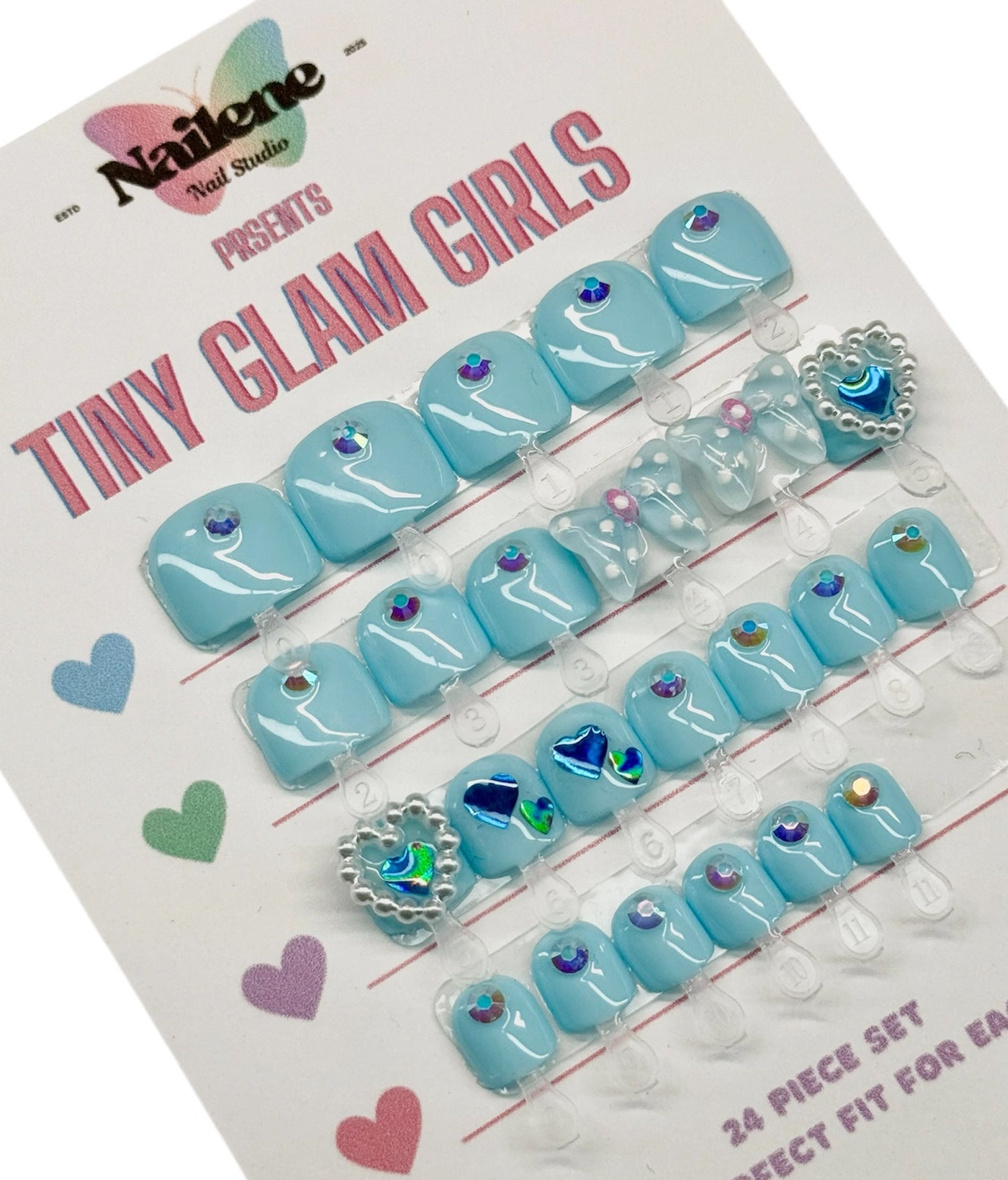Set of blue nail art decorations on a display card with 'Nailene' branding.