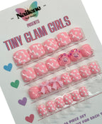 Packaging of 'Tiny Glam Girls' nail art decorations with pink and white designs on a white background.