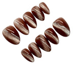 Chocolate-coated candies on a white background