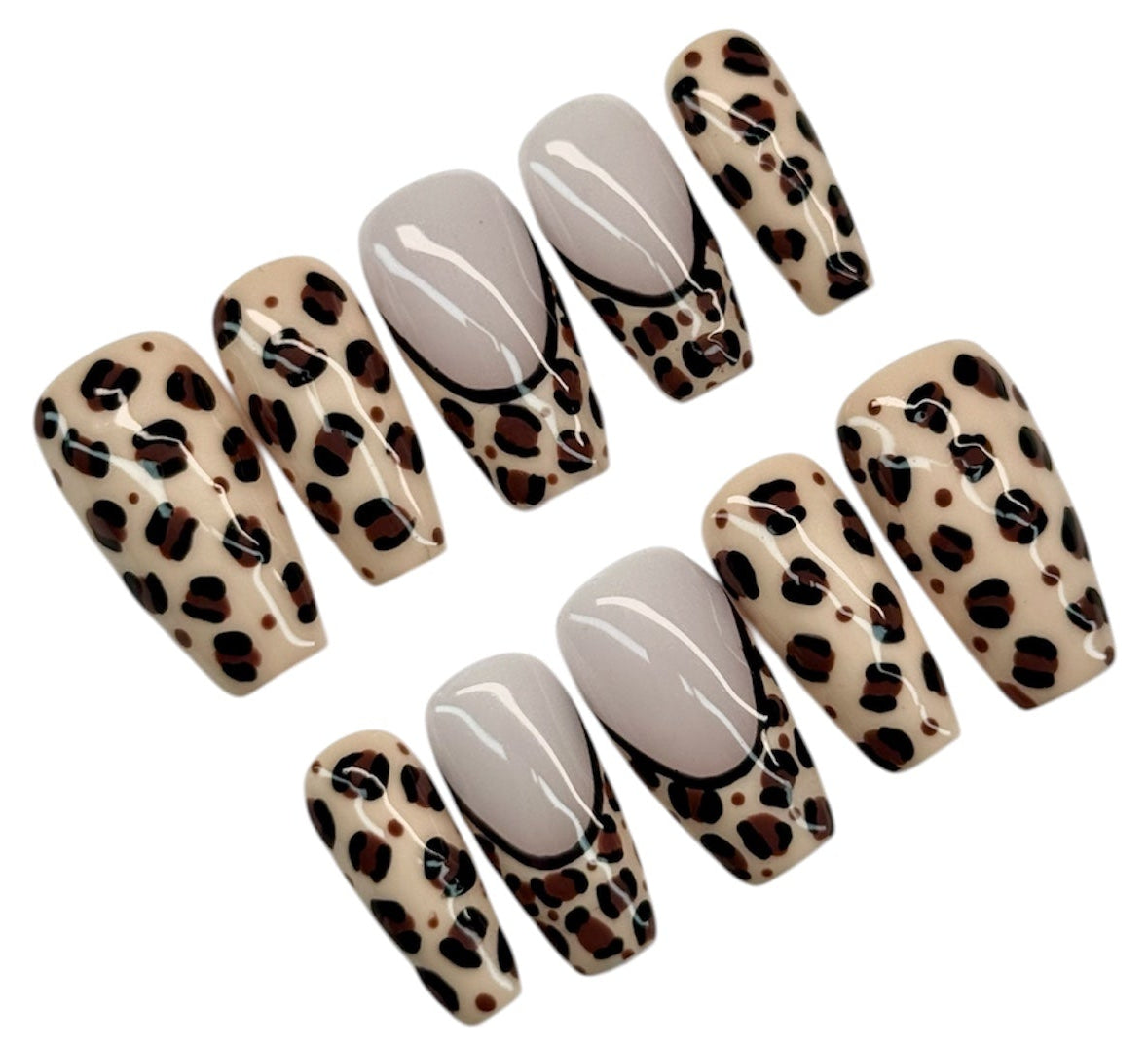 Set of press-on nails with leopard print and white designs on a white background