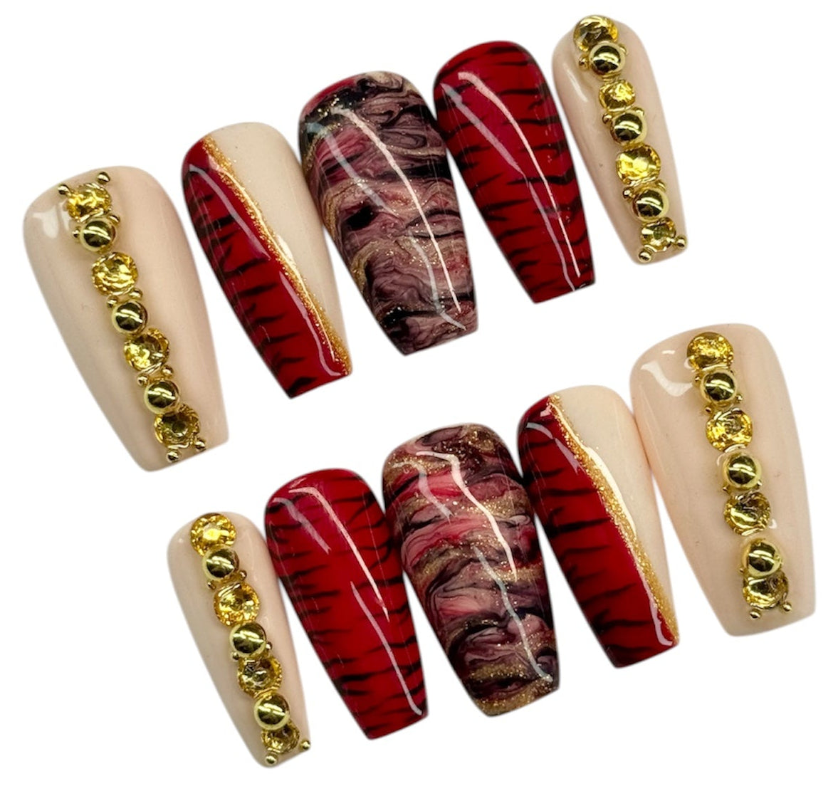 Set of nail art designs with gold accents on a white background