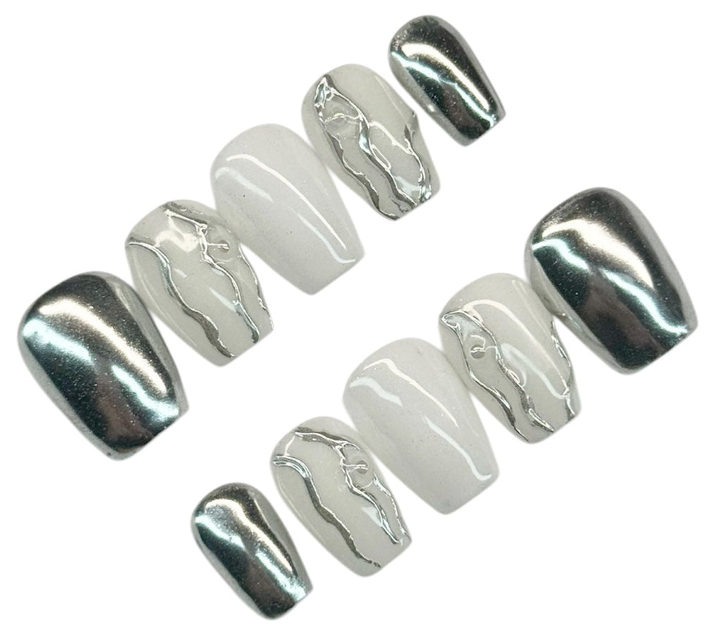Set of silver chrome and milky white nail polish on a white background