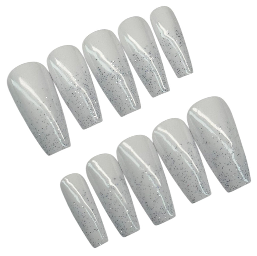 Set of white with glitter polish nail extensions on a white background