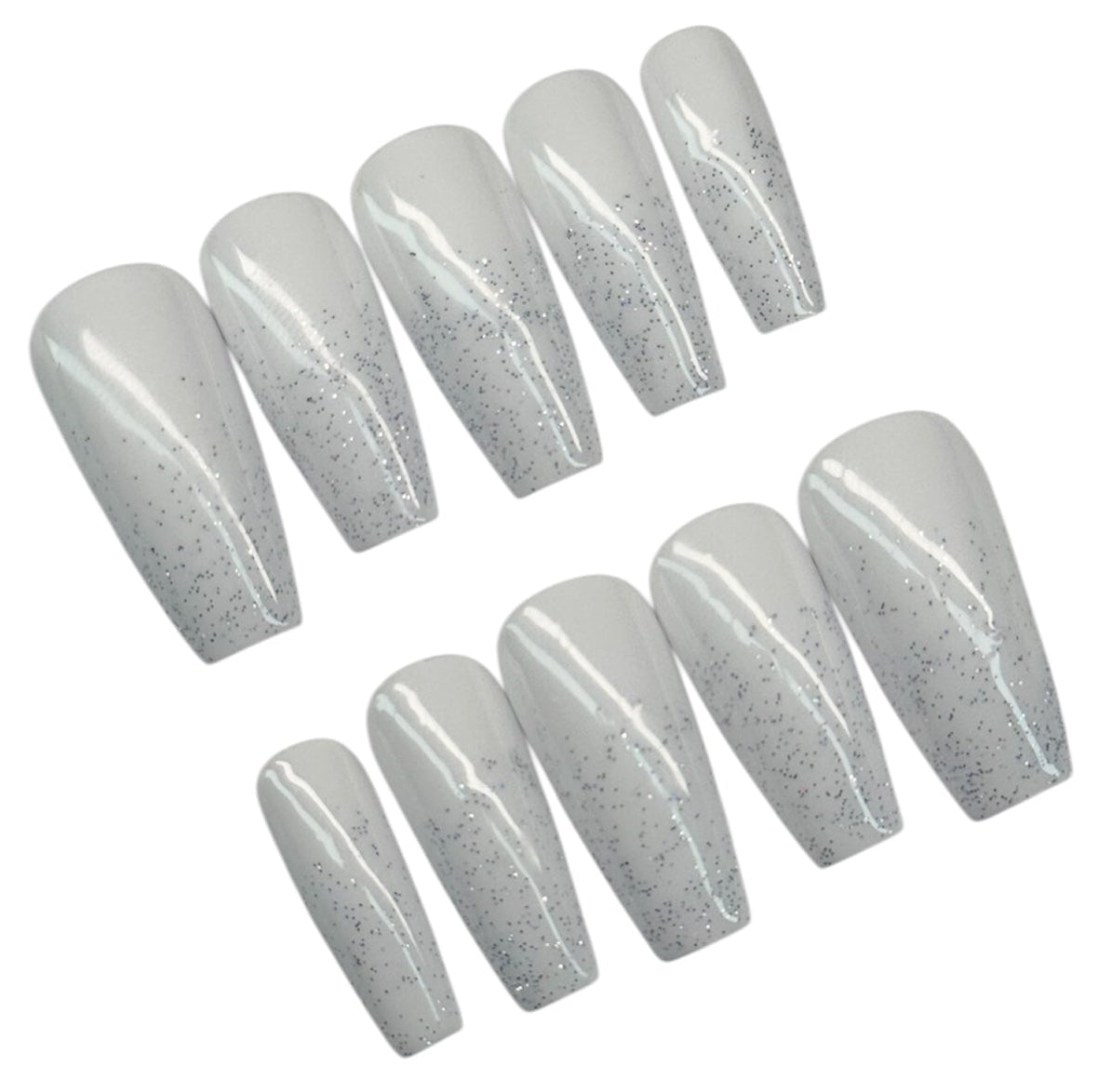 Set of white with glitter polish nail extensions on a white background