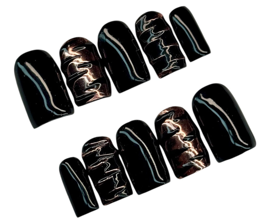 Set of black and gold gothic emo nail art designs on a white background