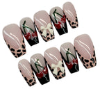 Set of press-on nails with various designs on a white background