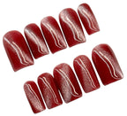 Set of dark pink cat eye nail polish strips on a white background