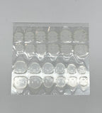 Sheet of clear adhesive patches on a gray background