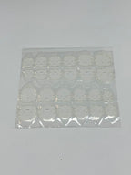 Sheet of adhesive tabs on a white background